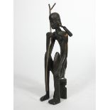 An African cast bronze figure of a seated woman, 21cm,