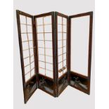 A Japanese black lacquered hardwood four panel folding screen, Meiji period, eight trellis design