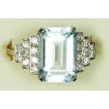 An aquamarine and diamond dress ring, stamped PLAT, claw set with a step cut stone, 12 x 8mm,