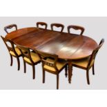 A 19th Century mahogany extending dining table, with three additional leaf insertions and a pair