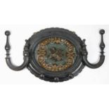 A Victorian ebonised oval wall mounted hat stand with bead work panel, 27 x 32cm.