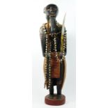 A carved and painted wooden figure of a warrior, probably Ghanaian, 66cm.