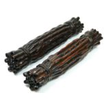 A Chinese pair of hardwood scroll weights, in the form of tied bamboo rods, 24cm.