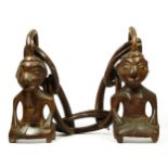 An African carved hardwood married man and woman, double chain, probably Central Congo, 86cm