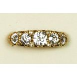 An 18ct gold five stone diamond ring, carved claw set with graduated old cut stones, diamond