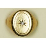 A 9ct gold and diamond signet ring, star set with a brilliant cut stone, 7.1gm, O 1/2.