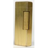Dunhill, a ribbed gold plated Rollagas lighter.