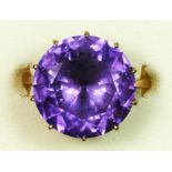 A 9ct gold purple/blue colour change synthetic sapphire dress ring, diameter 15mm, M 1/2, 5.8gm