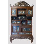 Late 19th century Japanese Meiji period Shibayama display cabinet, the moulded cornice with carved