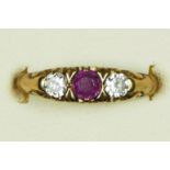 A 9ct gold Edwardian style ruby and diamond three stone Ring, carved claw set with brilliant cut