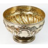 A Victorian silver punch bowl, Sheffield 1900, with lobed, embossed and chased decoration, later