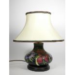 Moorcroft, a contemporary tube lined Clematis pattern baluster lamp, 19cm.