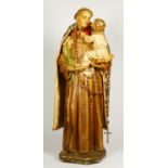 An early 20th century painted plaster statue of St Antony of Padua holding the infant Jesus, 63cm.