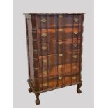 A South African stinkwood Dutch colonial style six height chest of drawers, the front of