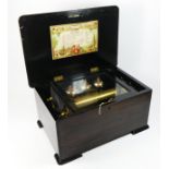 An early 20th century rosewood and satin wood inlay Swiss musical box, the rising lid to original