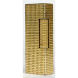 Dunhill, a crosshatched gold plated Rollagas lighter.