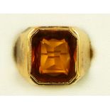 A gold mounted rectangular citrine ring, tests as 18ct, the stone of good colour, 14 x 11mm, K, 6.