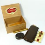 A leather cigar case, made in England, together with Embassy President and Henri Wintermans