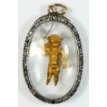 A Georgian rose diamond silver set gold pendant, with encased gold cherub with trumpet, 31 x 22mm.