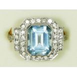 An Art Deco style aquamarine and diamond panel ring, stamped PLAT, milligrain collet set with a step