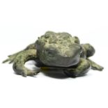 A Chinese cast bronze frog, 9.5 x 8.5cm. Label stating it was found in debris at the site of the