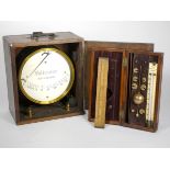 A Sikes hydrometer, brass, with brass weights, in a mahogany case with fitted interior, including