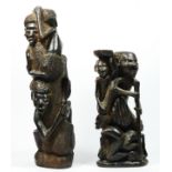 A West African carved hardwood figure group of four men climbing a tree trunk, 33cm and another of a