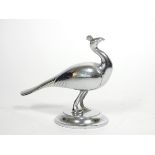 A vintage chrome car mascot, in the form of a peacock, signed T.C., 15 x 13cm