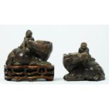 A Chinese pair of carved soapstone water buffalos, with driver, 10 x 9 x 5.5cm, one on hardwood
