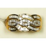 A 9ct gold, brilliant and tapered baguette cut diamond dress ring,, stated weight 0.75cts, colour
