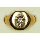 A 9ct gold and diamond signet ring, star set with an old cut stone, I, 3.6gm