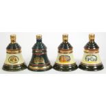 Four Bell's collectors decanters, of Festive interest, with contents, to include Christmas 1988 (