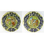 A pair of Italian majolica chargers, crowned M, depicting mythological/biblical scenes, diameter