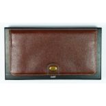 Dunhill, a brown leather wallet, product code WU1110D, Dunhill guarantee card dated 7.6.01, 18 x