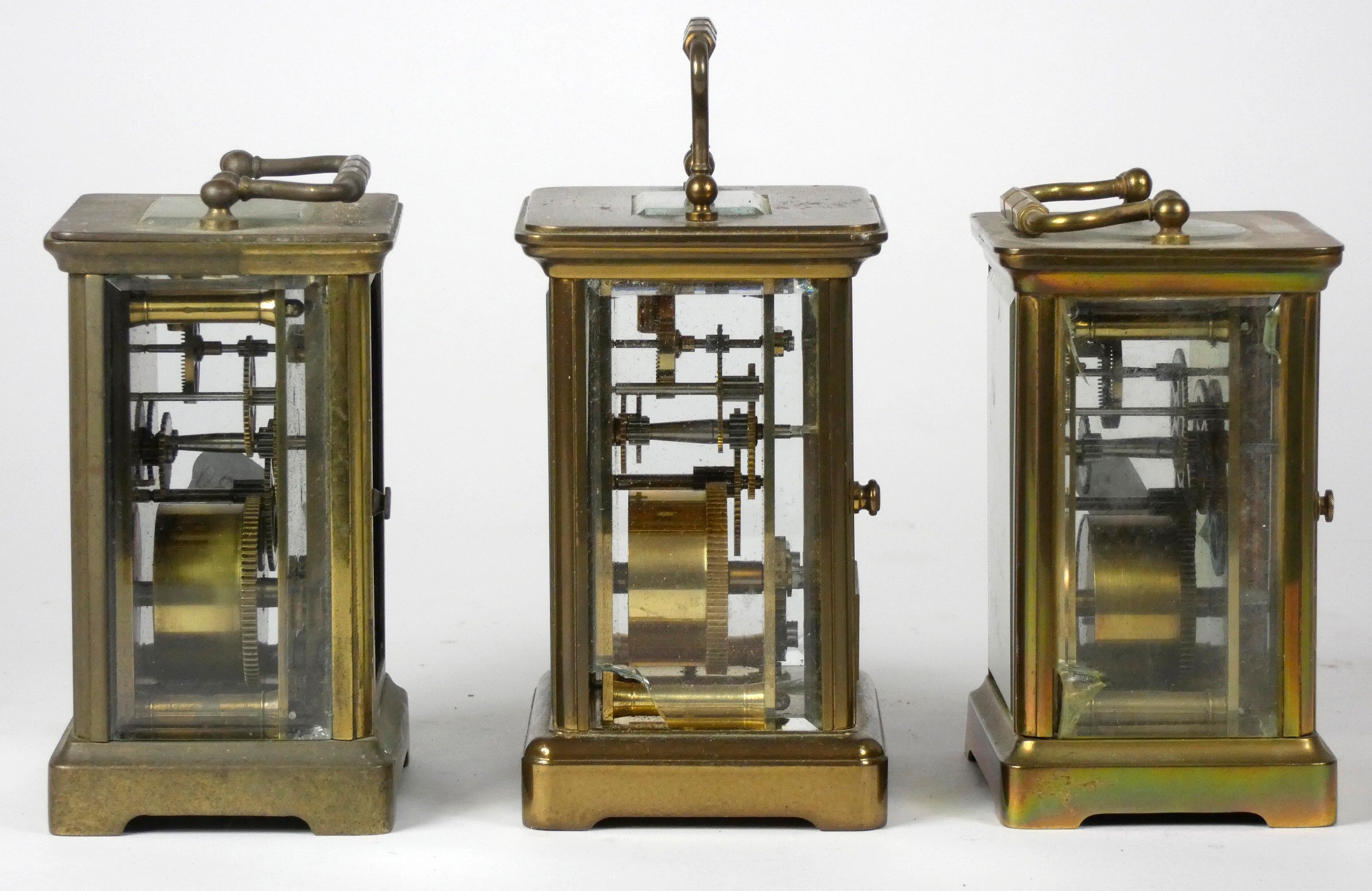 Three French mid 20th Century brass carriage clocks, white enameled dials with Roman numerals, - Image 2 of 3