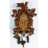 A Black Forest cuckoo clock, c1960s, mechanical movement with weights & pendulum.