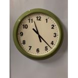 An Ikea 'Snugga' quartz wall clock, metal case with plastic front, white dial with Arabic