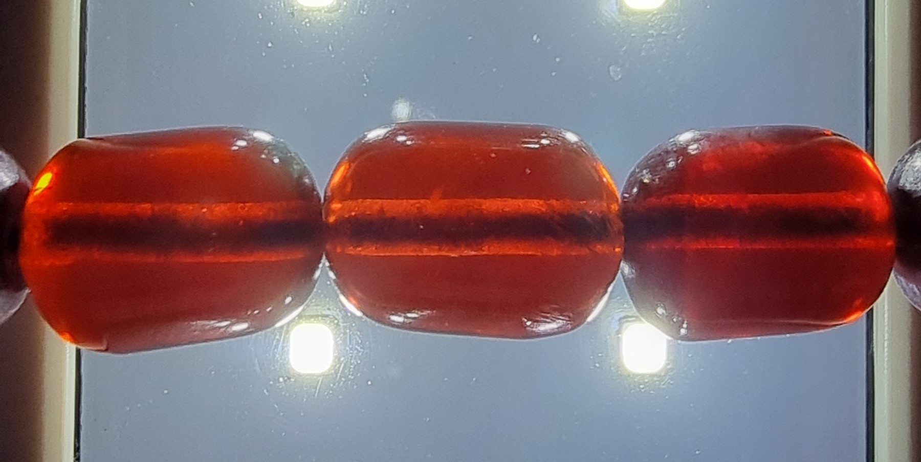 A cherry red amber bead necklace, 63gm, the largest bead 17 x 12mm - Image 4 of 6