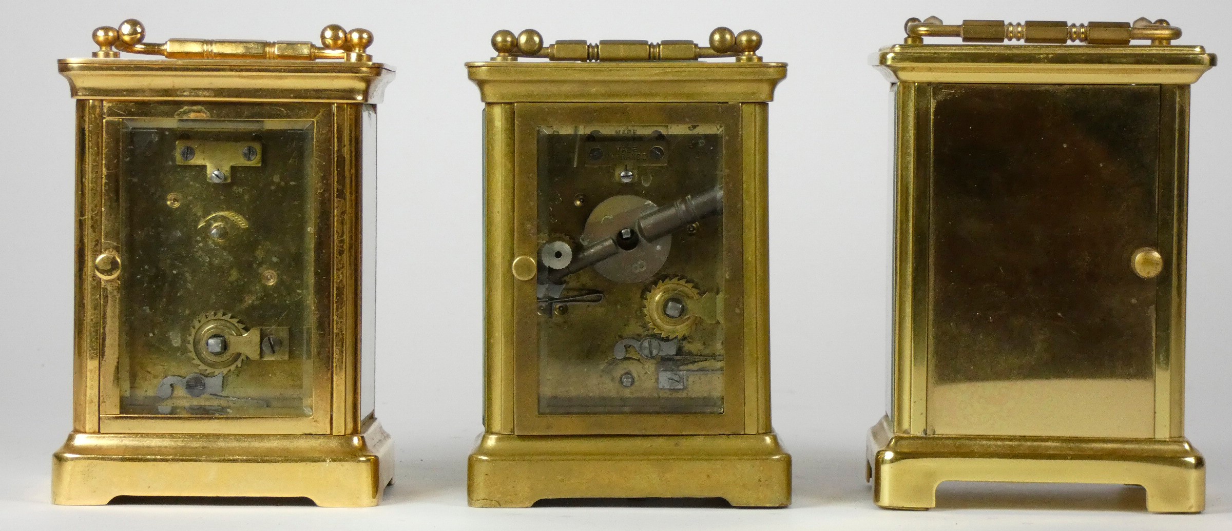 Three early 20th Century brass carriage clocks, white enameled dials with Roman numerals, 8 day - Image 3 of 3