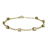 A 9ct gold and claw set opal line bracelet, 18cm, 2gm