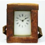 A brass carriage time piece, white enamel dial, 11.5cm, key and travel case