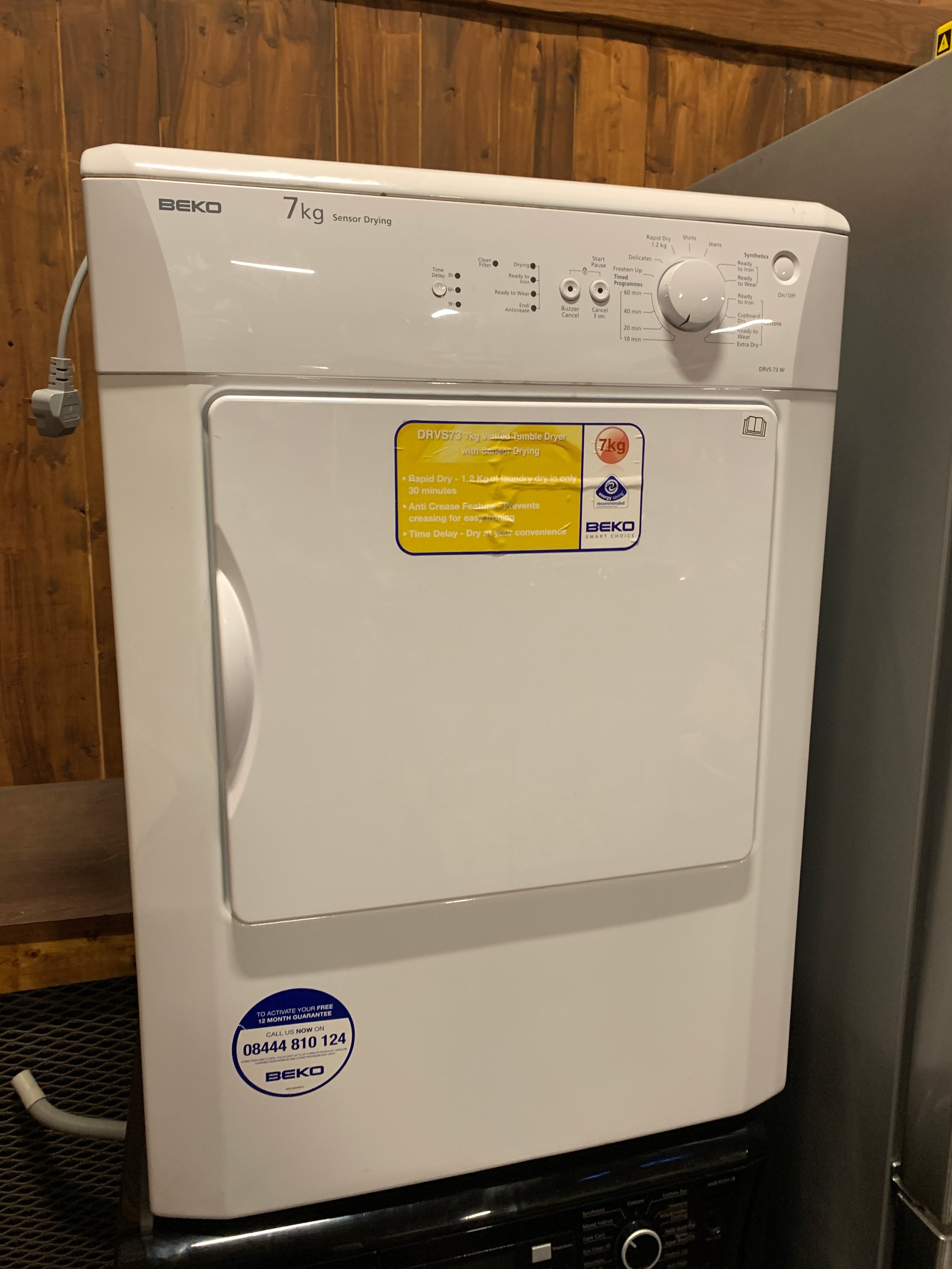 A Beko tumble dryer, 7kg, sensor drying, model DRVS 73W. H83cm, W60cm, D51cm.