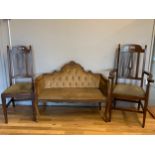 A Saloon / Parlour loveseat, mahogany frame with carved floral motif, padded upholstered seat, on