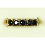 A 9ct gold five stone sapphire ring, K 1/2, 2.5gm
