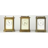 Three mid 20th Century brass carriage clocks, having 8 day movements, in need of repair (3).