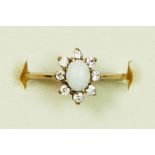 A 9ct gold opal and white stone cluster ring, E 1/2, 1.1gm