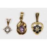 A 9ct gold and brilliant cut diamond solitaire pendant, stated weight 0.05cts, an amethyst pendant