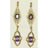 A pair of 9ct gold and amethyst ear pendants, 22mm and a garnet pair, 26mm, 4.8gm