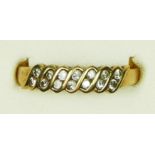 A 9ct gold and brilliant cut diamond set dress ring, stated weight 0.25cts, Q, 2gm