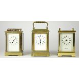 Three brass carriage clocks, enameled dials with Roman numerals and 8 day movements (Spares or